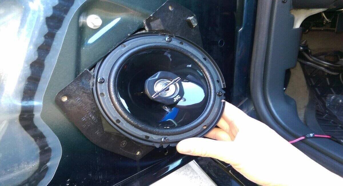 how to stop car door rattling from speakers